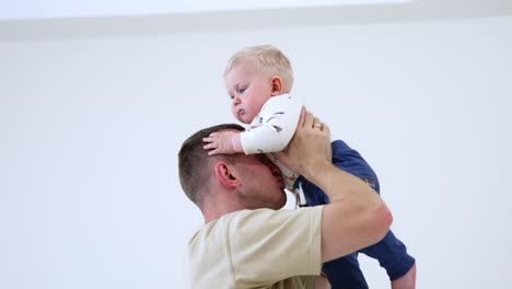 parenthood lifestyle. family playing indoor with small cute baby.