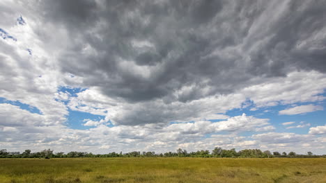 Cumulus-clouds-form,-advance-over-flat-Okavango-time-lapse-landscape