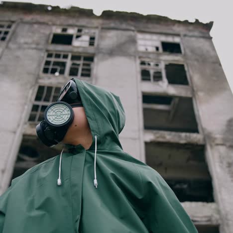 woman in safety suit and respirator. person in protective uniform during chemical attack in abandoned place. nothing to breathe. pollution of the environment