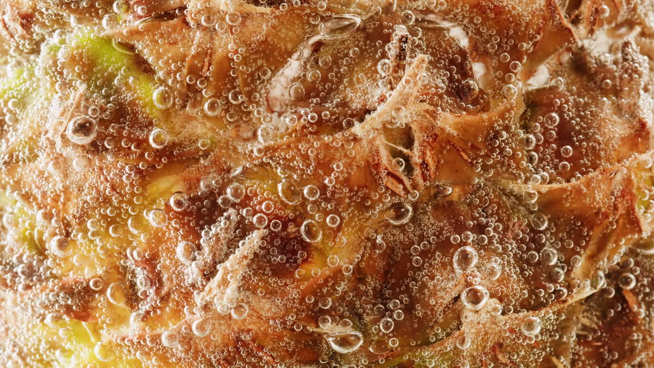 Close-up of a pineapple covered in bubbles