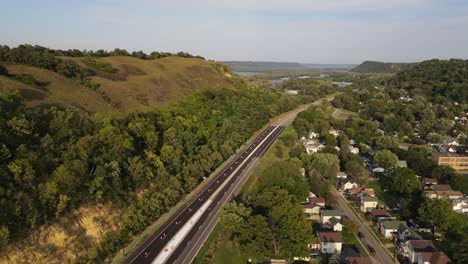 bluffs next to a road in red wing minnesota during summer time aerial footage