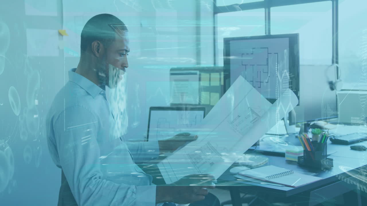 Reviewing architectural plans with animation overlay, man working in modern office