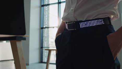 person wearing light-up led belt in office