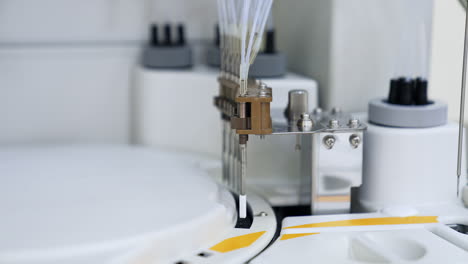 apparatus detail moving up and down performing test. technological advanced equipment in the modern blood test laboratory.