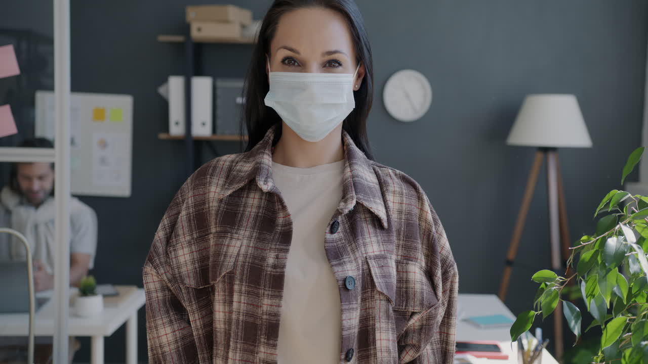 Woman Wearing Mask in Modern Office