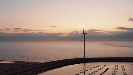 Windturbines-and-aquaculture-during-sunset-on-the-island-Neeltje-Jans,-the-Netherlands