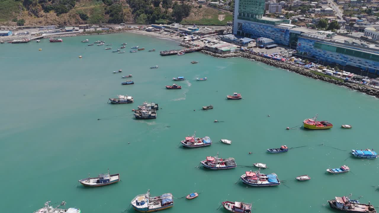 Group Of Fishing Boats Moored Off Pier At San Antonio Port In Chile