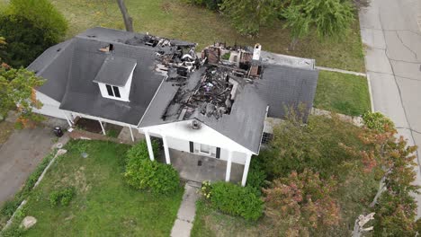 Burned-interior-and-rooftop-of-private-estate,-aerial-drone-view