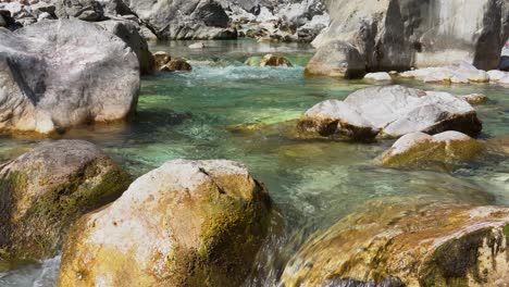 crystal water of mountain river streaming from melted snow in spring, waterfall wallpaper