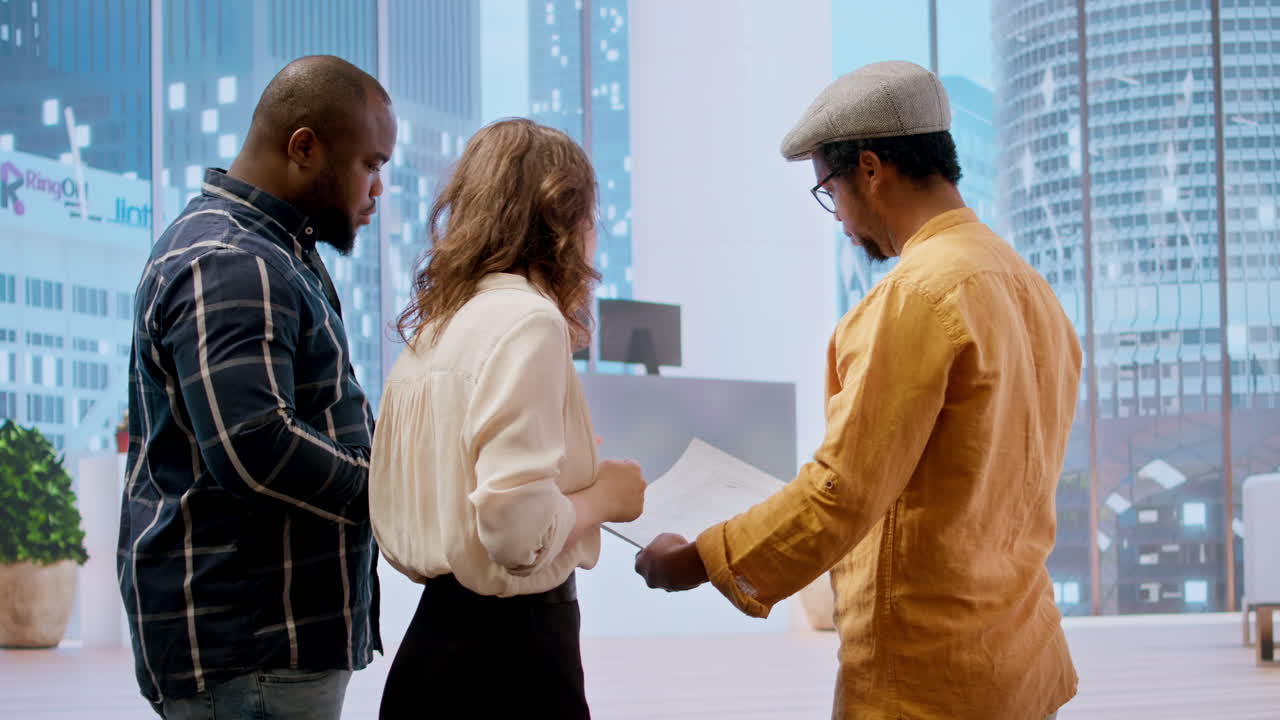 Corporate team reviewing architectural plans for a new office