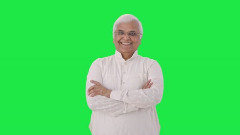 Happy-Indian-old-man-standing-crossed-hands-Green-screen