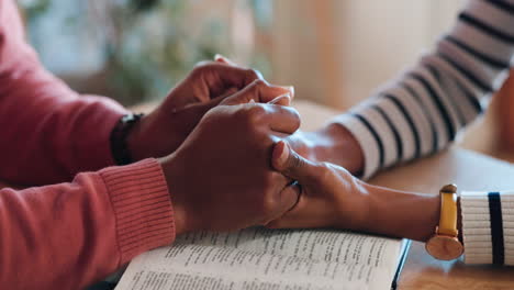 couple, together and holding hands with bible