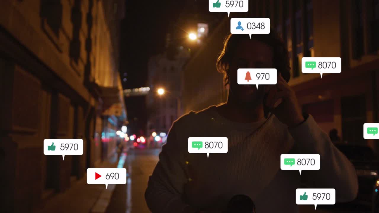 Animation of social media icons and numbers over caucasian man using smartphone