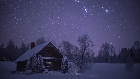 time lapse shot of flying stars at night sky over rural winter landscape with wooden house - 5k timelapse