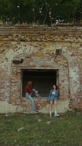 friends near an old brick wall