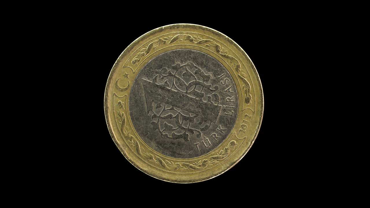 Turkey 2012 1 lira coin reverse with denomination and traditional motif rotating on black background