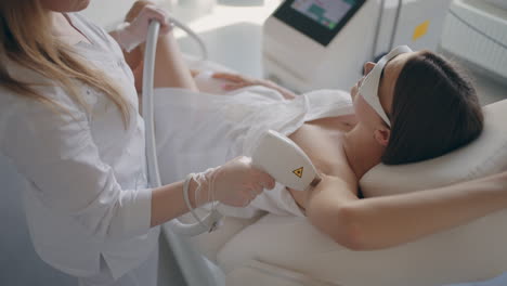laser-hair-removal-of-armpit-in-modern-cosmetology-clinic-adult-woman-is-doing-epilation-in-beauty-salon