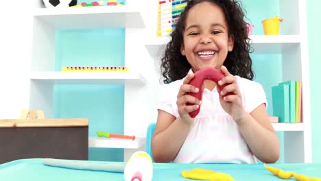 Little-girl-playing-with-modelling-clay