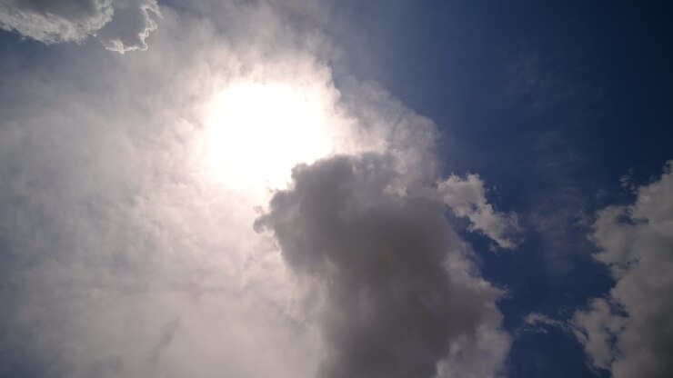 Time lapse sun and clouds moving on sky with sun shines and sunbeams