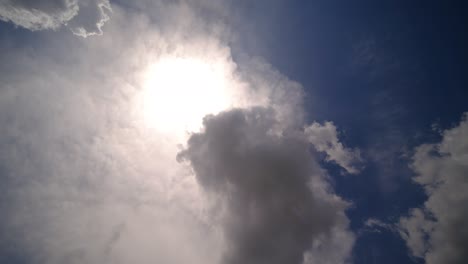 time lapse sun and clouds moving on sky with sun shines and sunbeams