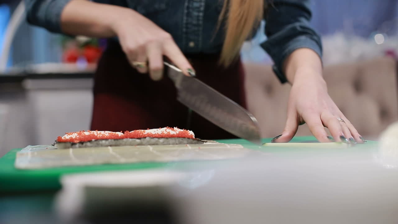 Sushi Roll Process. Closeup of chef hands preparing japanese food