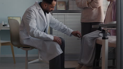doctor examining a child with her mother in the clinic