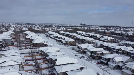 Aerial-view-of-a-suburban-community-in-Calgary,-Alberta-in-winter