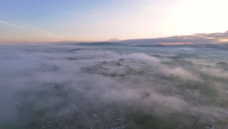 a misty sunrise in the countryside of indonesia