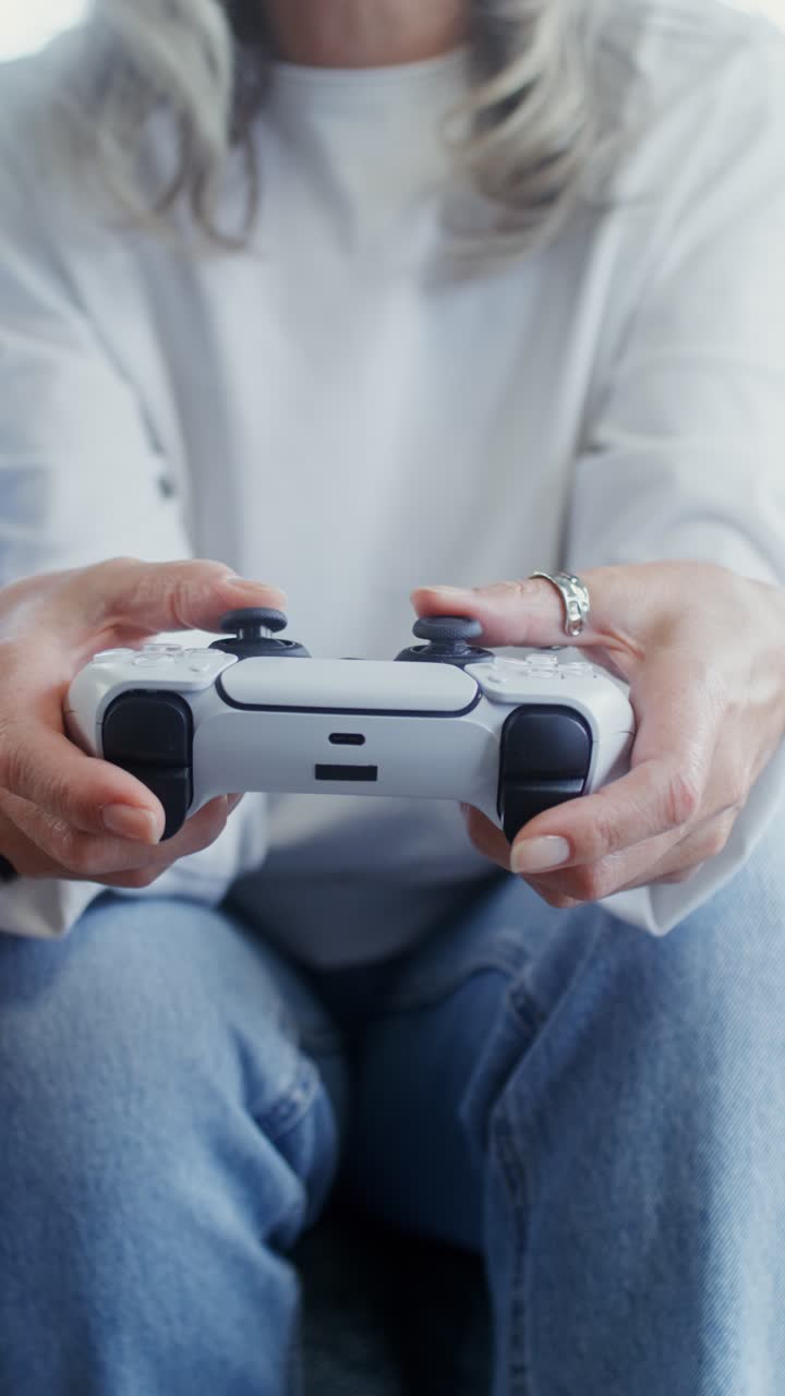 A person holding a game controller