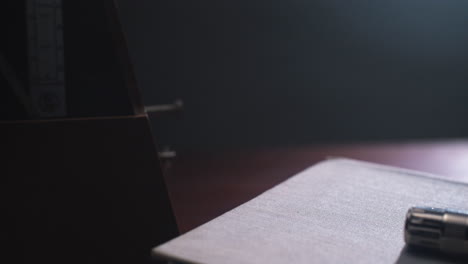 metronome set the rythm in the dark, old room
