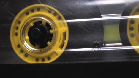 yellow transparent audio cassette in the tape recorder