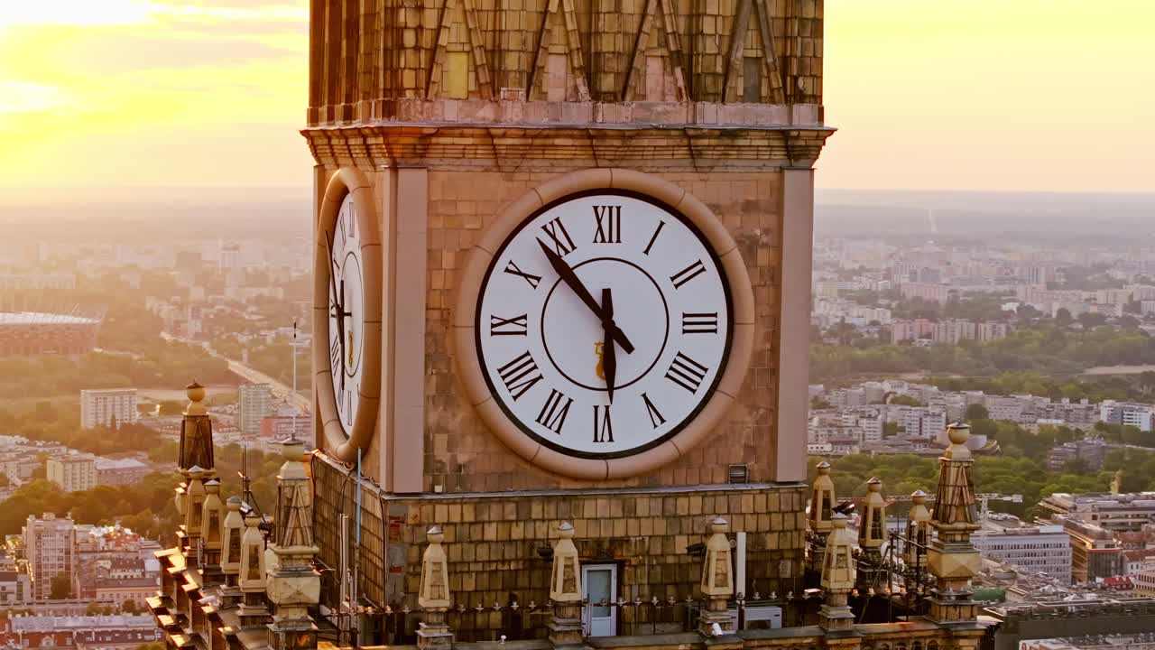 Epic aerial of iconic Warsaw clock tower at dawn as metaphor for rising markets