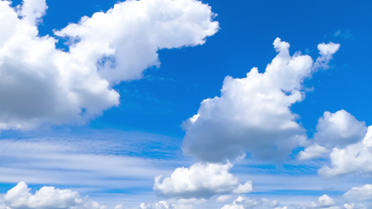 Different types of clouds moving in the bright horizon. Amazing heavenly cloudscape in the turquoise sky. Timelapse.