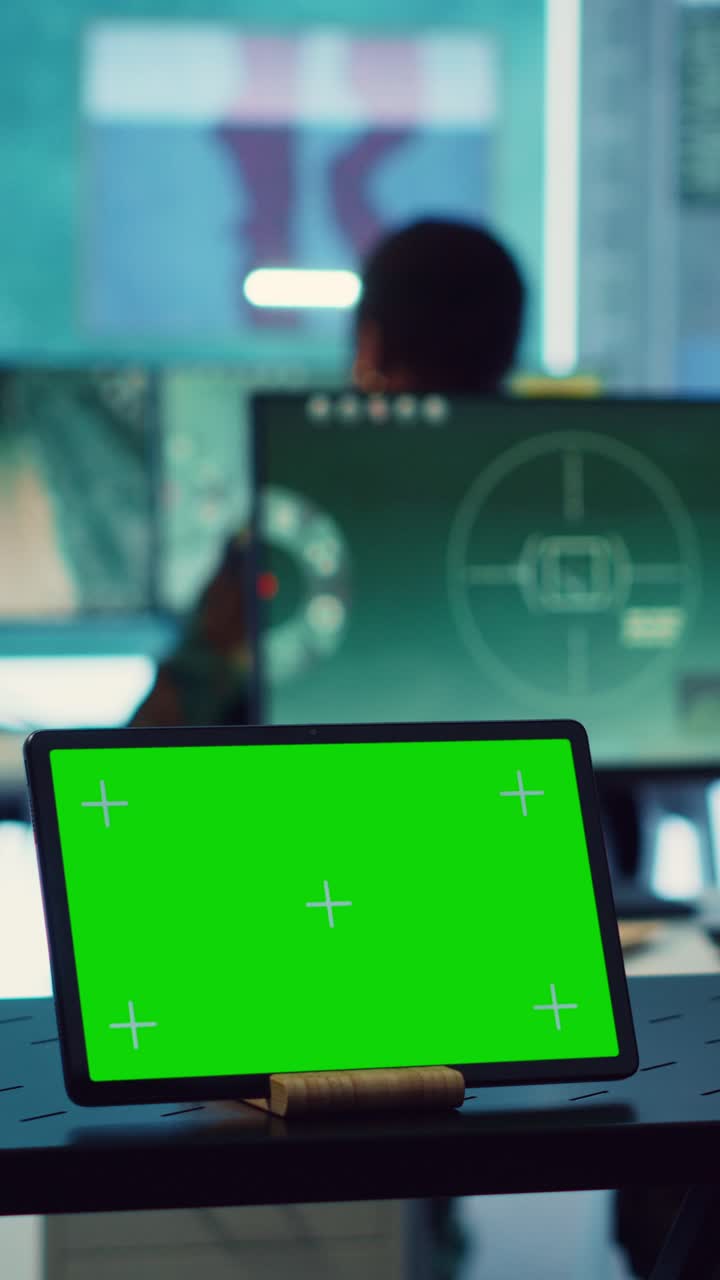 Tablet with Green Screen Display on Office Desk