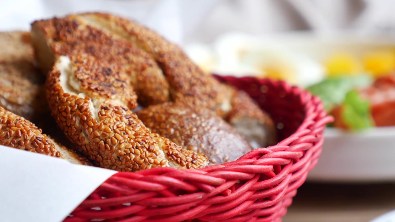 Traditional Turkish Simit and Bread in a Red Basket