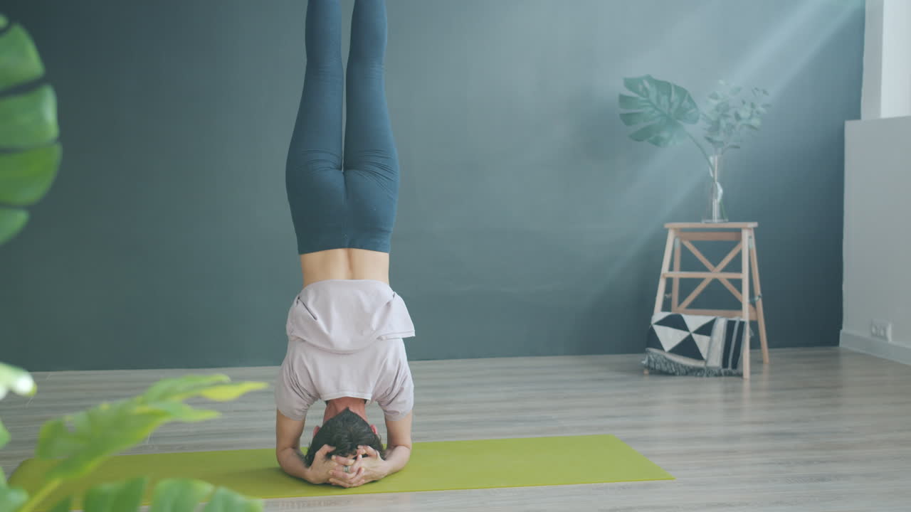 Yoga poses: Headstand and Forward Fold
