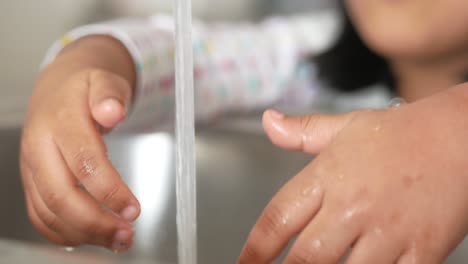 child washing hands