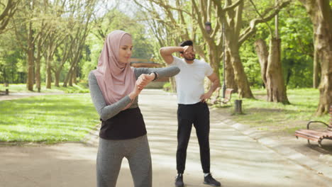 couple exercising in a park