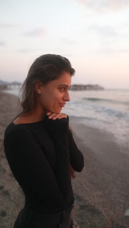 young woman at sunset beach