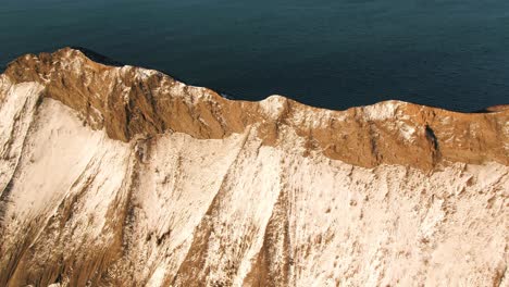 snowy mountain coastline view