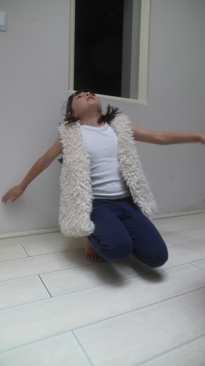 Girl playing and sitting in a room