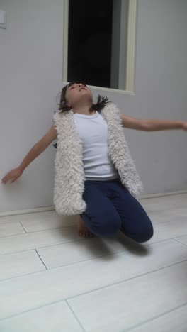 girl playing and sitting in a room