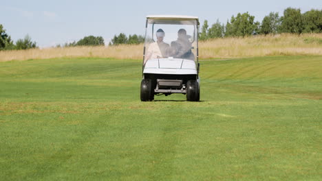 caucasian woman and african american man on the golf course.