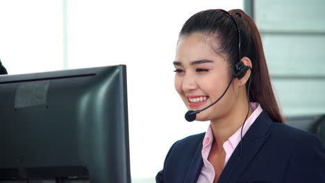 business people wearing headset working in office