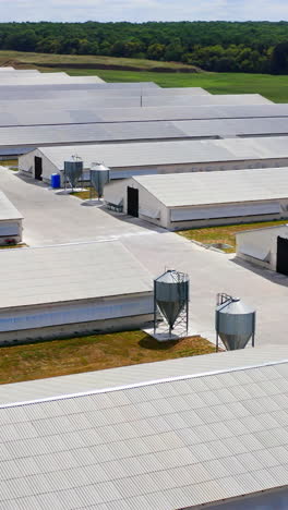 a modern, metal, prefabricated farm building. prefabricated farm building. view from above on poultry farm. vertical video