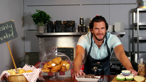 Man-standing-at-bakery-section