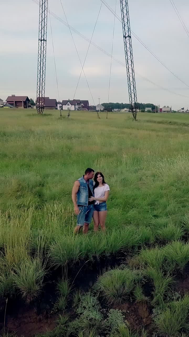 Couple in a grassy field