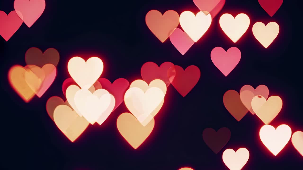 Romantic bokeh hearts in soft focus, glowing against a dark background