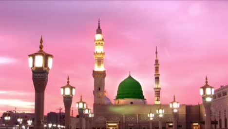 mid shot front view of the mosque with lights after sundown with a colorful sky at sunset