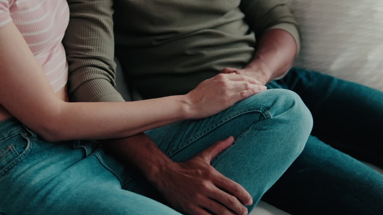 Couple Holding Hands at Home